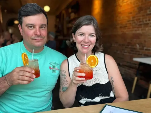Guests toasting with cocktails