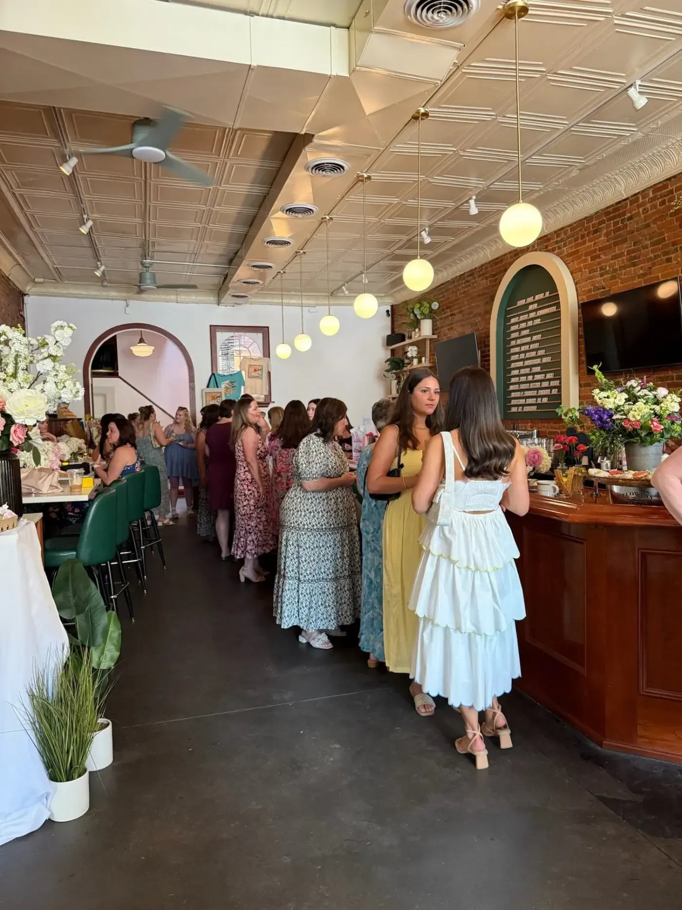 Guests mingling at a private party in the dining room