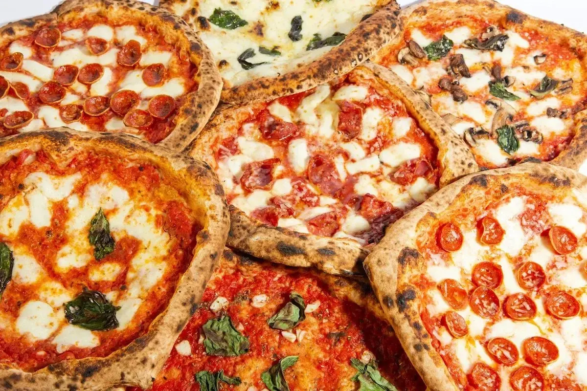 A pile of wood fired pizzas